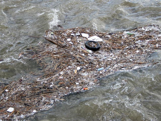 Flood water contaminated by waste and debris